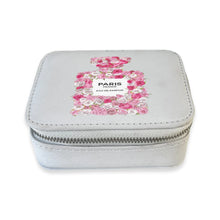Load image into Gallery viewer, Light gray zippered travel pill box featuring a floral perfume bottle design in red, pink, and white and "Paris France Eau De Parfum" in black text, displayed on a white background.