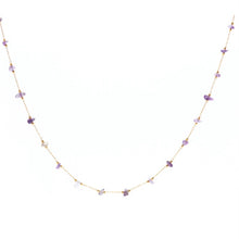 Load image into Gallery viewer, Gold chain necklace with small purple  stones and gold accents on a white background