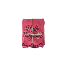 Load image into Gallery viewer, Pink scalloped edge face towel folded neatly with &quot;Hello Gorgeous&quot; embroidery, tied with string, on a white background. 