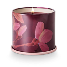 Load image into Gallery viewer, Candle in a  purplish decorative container with floral design on a white background