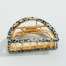 Load image into Gallery viewer, Leopard-print half-moon metal claw clip with gold hardware displayed on a white background. 