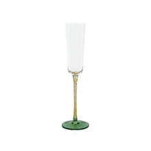 Load image into Gallery viewer, Champagne flute with a clear glass bowl, amber stem, and green circular base displayed on a white background.  