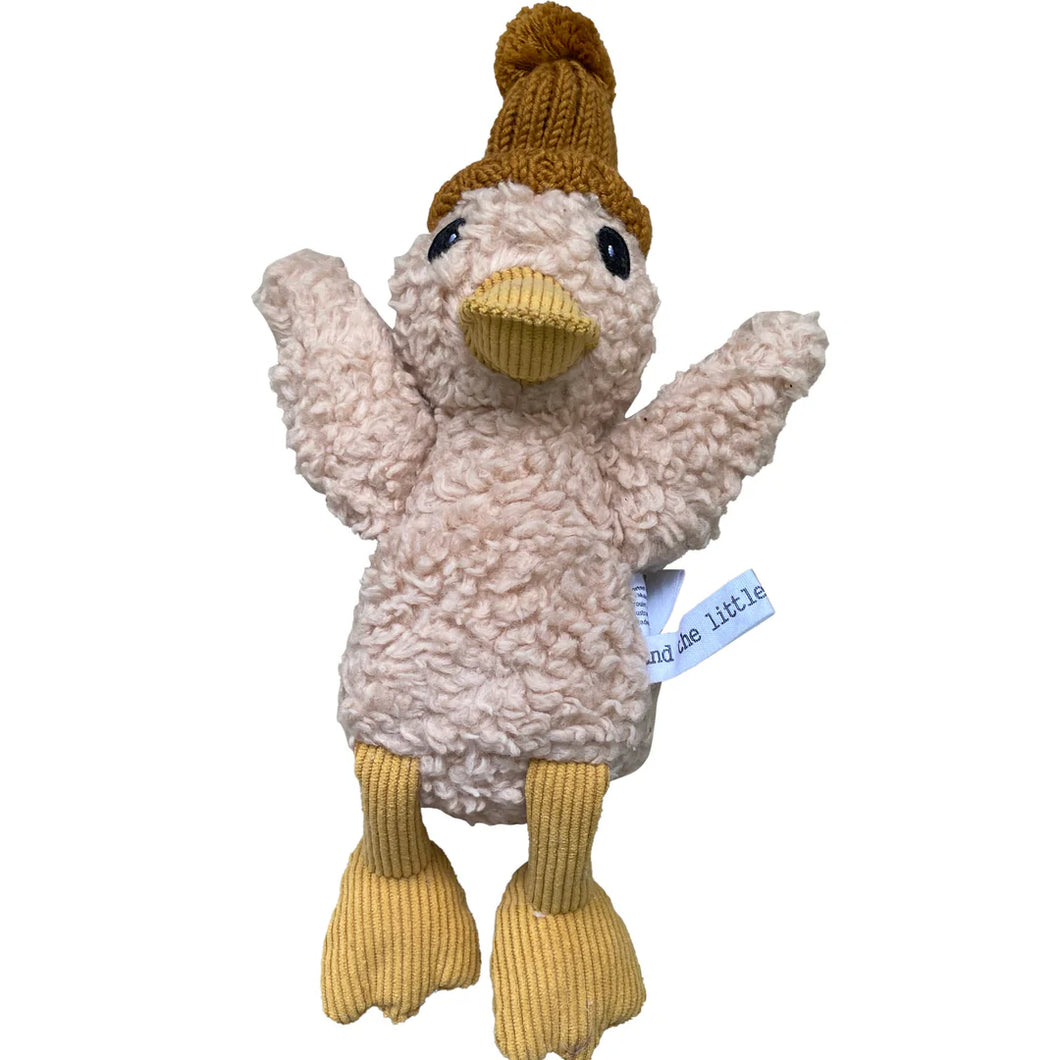 Merino wool and cotton cream-colored duck plushie, featuring a textured curly body, light brown corduroy beak and feet, and a tan knit hat, displayed against a white background.  