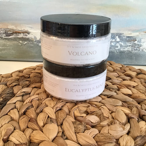 sugar scrub 2 styles with flowers around 