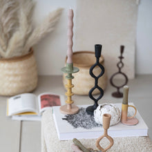 Load image into Gallery viewer, Collection of decorative candlesticks on a surface with a neutral background.