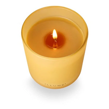 Load image into Gallery viewer, Yellow candle with a visible flame on a white background