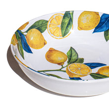 Load image into Gallery viewer, White melamine serving bowl with a yellow lemon and green leaf pattern interior, displayed on a white surface. 