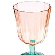 Load image into Gallery viewer, Close-up of a clear pink scalloped goblet glass with vertical ribbing and a green stem on a white background.