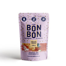 Load image into Gallery viewer, C'est Bon Bon Cocktail Sour gummies pouch with lavender packaging and yellow polka dots, colorful candies visible through window on a white background.