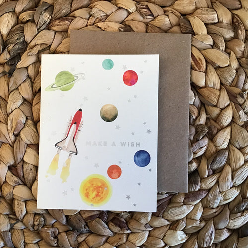 birthday card with planets, rocketship, silver stars and silver writing 