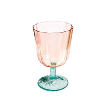 Load image into Gallery viewer, Clear pink scalloped goblet glass with vertical ribbing and a green stem and base on a white background. 