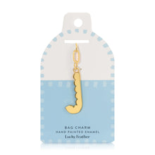Load image into Gallery viewer, 14K gold-plated hand-painted enamel initial bag charm featuring the letter J with a scalloped edge design and a brushed gold finish, attached to a key ring and clasp. Displayed on a white and blue Lucky Feather card with a light blue dotted brush-stroke borders labeled &quot;Bag Charm Hand Painted Enamel.&quot; Displayed against a white background. 