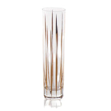 Load image into Gallery viewer, Clear glass champagne flute with vertical gold stripe decals displayed on a white background. 