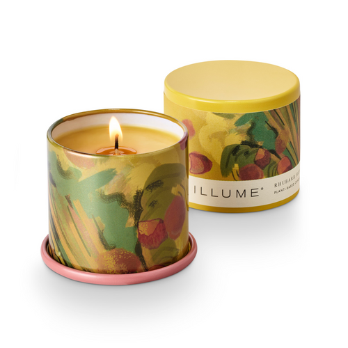 Illumè candle with floral design and yellow lid on a white background