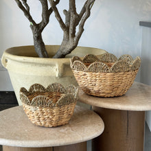 Load image into Gallery viewer, Small and large handwoven seagrass bowls with scalloped rims on round stands.