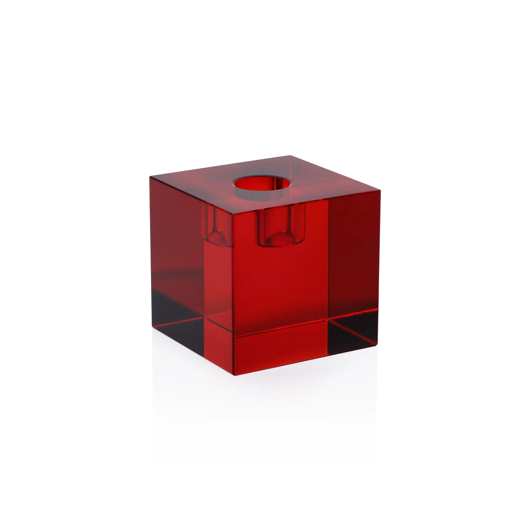 Single small red square shaped crystal glass taper candle holder displayed against a white background.