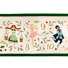 Load image into Gallery viewer, Close-up of the gold &quot;8&quot;, &quot;9&quot;, and &quot;10&quot; illustrations from the 12 Days of Christmas table runner featuring a red-haired maid carrying pails, a dancing ballerina wearing a pink tutu, and a leaping lord surrounded by scattered green foliage on a white background with a green border.