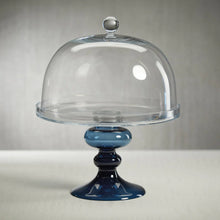 Load image into Gallery viewer, Cake stand with a clear glass dome on a blue stand against a neutral background.