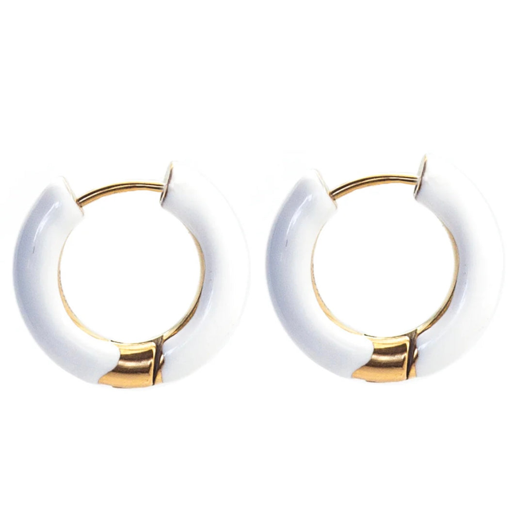 Pair of white hoop earrings with gold accents on a white background