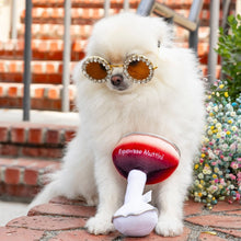 Load image into Gallery viewer, Small furry white dog wearing sparkly sunglasses sitting on brick pavers with a plush martini-glass dog toy featuring a red-to-cream gradient bowl, silver rim, white stem, and embroidered "Espawsso Muttini" text in white. 