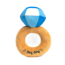 Load image into Gallery viewer, Plush ring-shaped dog toy with a tan band, a blue faceted diamond accent, and embroidered "Bling Bling" in black text, shown on a white background. 