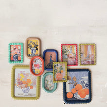 Load image into Gallery viewer, Collection of decorative picture frames in different colors and designs ,with various pictures of art in frames. On a white wall.