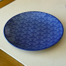 Load image into Gallery viewer, Blue Waves porcelain appetizer plate with blue stamped dot wave pattern and blue rim displayed on a white textured surface.