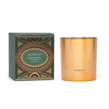 Load image into Gallery viewer, Metallic gold 2oz. candle with its decorative hunter green and metallic gold box displayed on a white surface. 