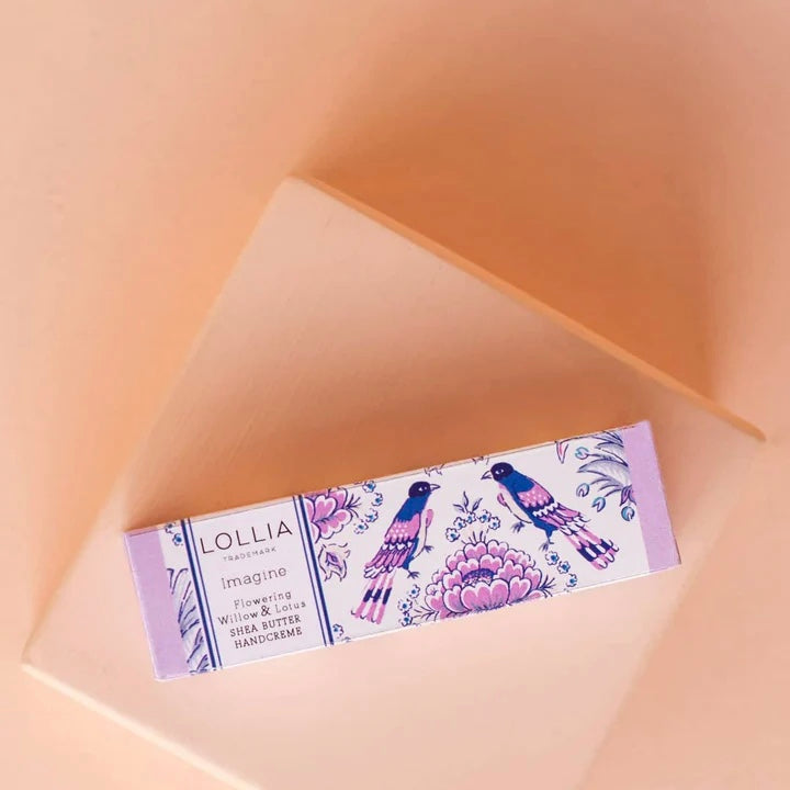 Lollia hand cream packaging on a soft peach background