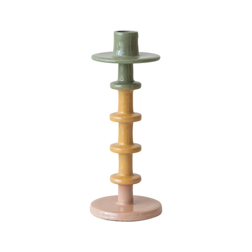 Multicolored  tapered ceramic candle holder on a white background.
