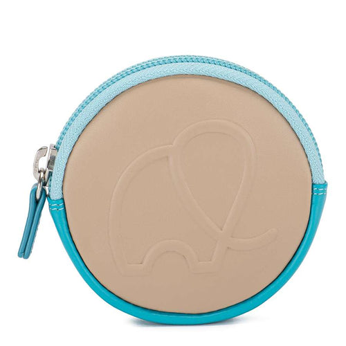 A round beige coin purse with an elephant design in the middle, with a two toned blue zipper closure and a small leather tab. On a white background.