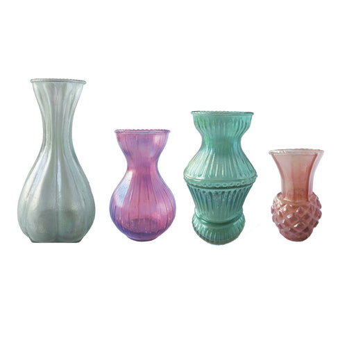 Four glass vases of different designs, sizes, and colors on a white background