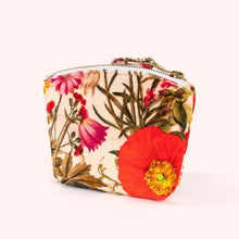 Load image into Gallery viewer, Fine Flowers velvet mini pouch featuring red, pink, and yellow flowers with green stems on a cream background, top zipper with gold-tone hardware and matching fabric pull, displayed on a white background. 