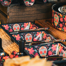 Load image into Gallery viewer, Day of the Dead Sectional Taco Tray, melamine, three compartments featuring aqua sugar skull and colorful floral design on black background, displayed with matching serving spoons and coordinating pieces. 