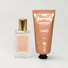 Load image into Gallery viewer, Granado Nostalgia perfume in a clear glass bottle with pink and gold label with gold cap beside Nostalgia hand cream in a peach tube with gold floral detailing and black cap on a white background. 
