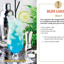 Load image into Gallery viewer, Summer Sips By Adams Media, Blue Lagoon recipe card featuring a bright blue cocktail in a hurricane glass filled with ice, garnished with a lime wheel and two black straws, with a stainless steel cocktail shaker , bar jigger, and green tropical foliage in the background beside a printed recipe. 