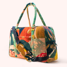 Load image into Gallery viewer, Luxe Exotic Leaves Weekender Bag with large bold tropical leaf pattern in green, coral and mustard tones, structured duffel shape with double handles and detachable shoulder strap, against white background. 