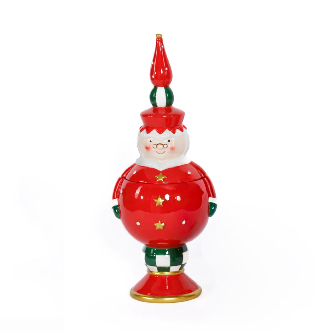 Hand-painted ceramic Mrs. Claus cookie jar in red, green, and white with gold star accents, green-and-white checkered base, and a tall red, white, and green finial, displayed against a white background.   