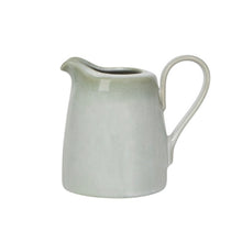 Load image into Gallery viewer, Aquarius Sage stoneware creamer with reactive glaze, curved spout and handle on a white background.