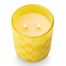 Load image into Gallery viewer, Lemongrass &amp; Lime Leaves Glass Candle, lit double-wick candle with white wax in yellow vessel with raised diamond geometric pattern shown in slightly overhead view against white background.