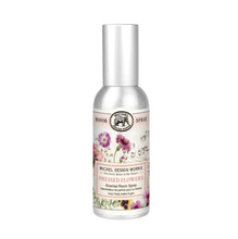 Load image into Gallery viewer, Michel Design Works Pressed Flowers scented room spray in metal silver bottle with pink, purple, and cream floral label, displayed on a white background. 