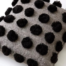 Load image into Gallery viewer, Jitana handcrafted gray wool throw pillow with black pom-pom accents. 
