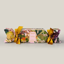 Load image into Gallery viewer, Granado Nostalgia scented cracker with tropical floral packaging and yellow ribbon bows on a white background. 
