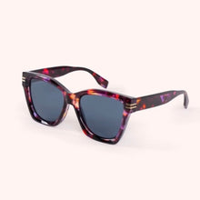 Load image into Gallery viewer, Isolde Tortoiseshell Sunglasses, chunky angular D-frame in deep purple and cherry red tortoiseshell pattern, polycarbonate frames with dark tinted lenses, angled side view against a white background. 