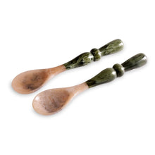 Load image into Gallery viewer, Resin Green Malachite Salad Servers, resin salad server set featuring one serving spoon and one notched serving spoon, both with warm beige and brown marbled heads and glossy dark green handles featuring a lighter green marbling and sculpted rounded details, displayed against a white background.