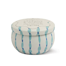 Load image into Gallery viewer, Round mini soy candle tin featuring blue vertical dotted stripe design with matching lid, shown closed on a white background.  