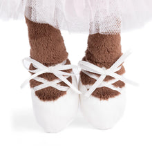 Load image into Gallery viewer, Close-up of plush monkey feet wearing white satin ballet-style shoes with ribbon laces, shown beneath a light pink tulle tutu. Against a white background. 