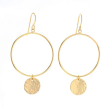 Load image into Gallery viewer, 14K gold-filled hoop earrings featuring a hand-hammered round disc charm on each, displayed on a white background. 