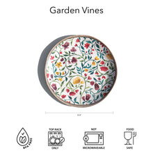 Load image into Gallery viewer, Melamine salad plate with a multicolor floral vine pattern and tan rim, shown with diameter measurement and care icons on a white background. 