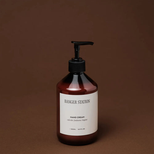 Ranger Station Hand Cream in an amber  bottle with a black pump and a white label reading 